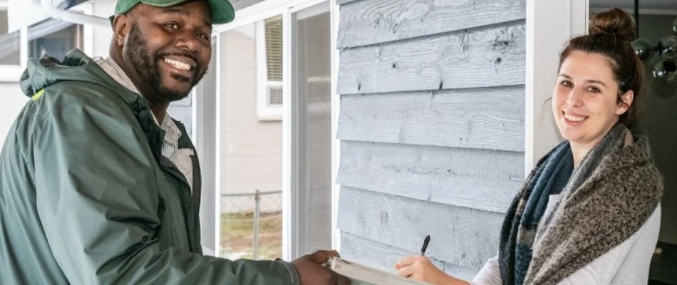 Technician assisting client with pest services in Bremerton, WA.